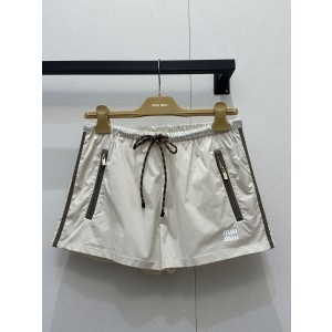 미우미우(MiuMiu) 나일론 지퍼 반바지 팬츠 의류